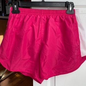 Pink and white running shorts
